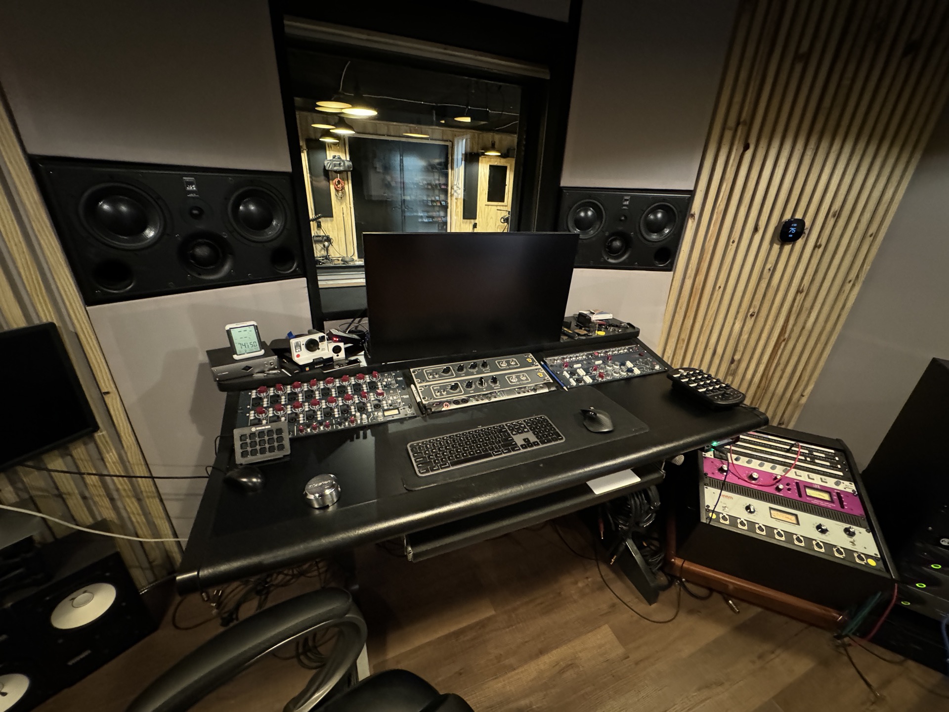Control room featuring ATC SCM45 monitors and Neve 1073 preamps