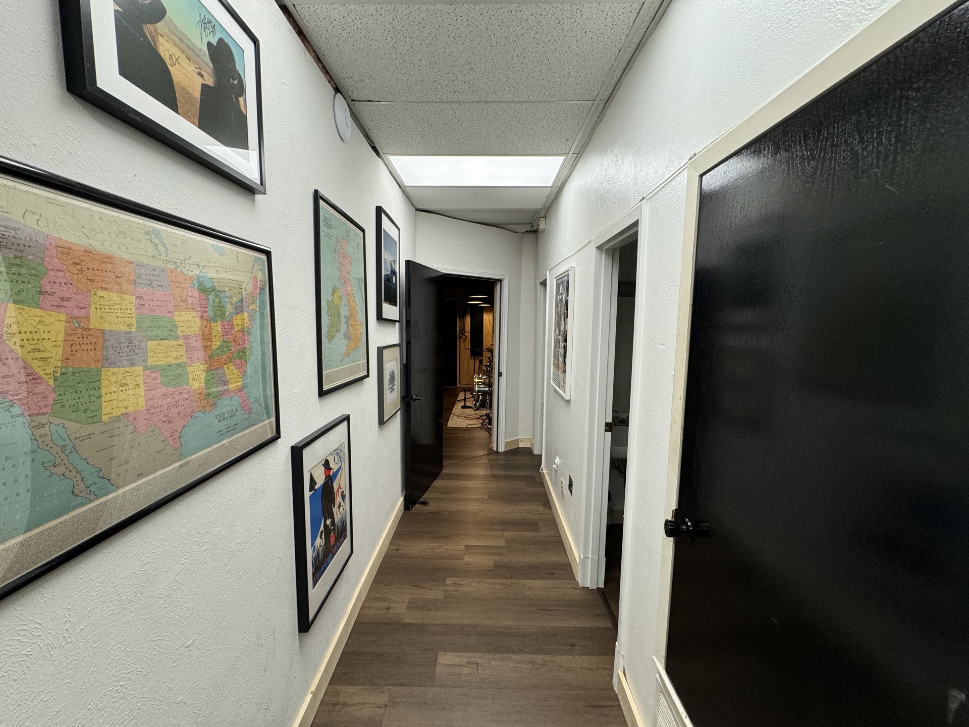 Studio hallway with vintage artwork and maps